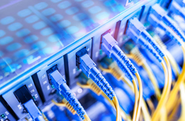Fiber optic cables connected to optic ports
